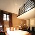 Hotel du Vin Bristol in Bristol guest room with mezzanine loft and wooden bed