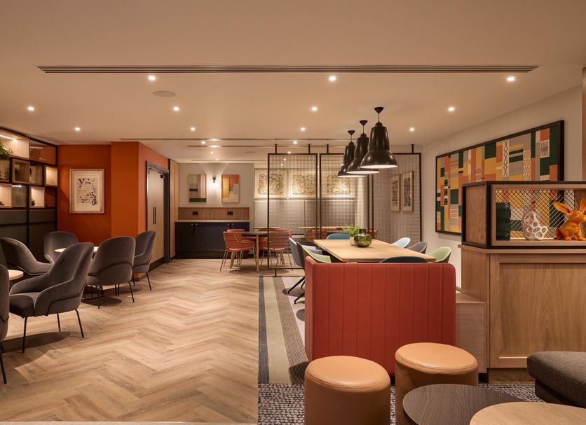 Holiday Inn London - Bloomsbury By IHG lounge with bar seating and herringbone wood flooring