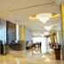Shangri-La Baotou lobby with marble floors, gold columns, chandeliers and reception area