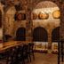 Contemplacion Resort & Spa in Ensenada wine cellar dining area with arched stone walls and wooden tables