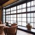 Rinn Shiki Juraku Kyoto lounge with leather chairs, wood tables and large window seating
