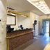 Century Star Urumqi Changjiang Road Hotel lobby reception desk with textured white wall in Ürümqi