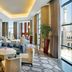 Hilton Suites Jabal Omar Makkah in Mecca lobby lounge with seating and large windows overlooking the mosque