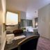 Studio 6 Toronto Mississauga room with desk, bed and doorway in Mississauga