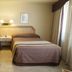 Hotel Diego de Almagro Santiago Centro guest room with two twin beds and bedside lamp in Santiago