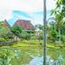 Hotel Deli River and Restaurant Omlandia in Medan with tropical gardens beside a lily-covered pond