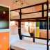 Urban Hostel Bangkok in Bangkok, bunk beds in a colorful hostel dorm room
