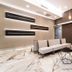 Hotel Milano Castello in Milan lobby lounge with marble floor, sectional seating, and wall-mounted TV