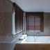 Aonang All Seasons Beach Resort bathroom with soaking tub and corner windows in Krabi