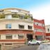 Hotel La Villette in Antananarivo exterior with balcony greenery and street parking