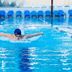 Kfar Maccabiah Business & Sport Hotel in Ramat Gan indoor pool with swimmer doing butterfly laps