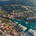 Aerial view of Cervo Hotel, Costa Smeralda Resort in Porto Cervo overlooking a marina and yachts