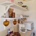 Suites Santo Domingo in San Miguel de Allende coffee station with mugs, kettle, microwave and decorative shelves