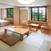 Colosseum Inn Tateshina room with tatami floor, twin beds, seating area, and large windows