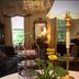 1842 Inn in Macon: lobby table with cookies, flowers, lamp, chandelier, and ornate seating