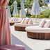 the goodtime hotel, Miami Beach: poolside lounge with round daybeds, umbrellas and palm trees