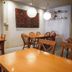 The Goose House Ubon in Ubon Ratchathani dining area with wooden tables, chairs, and pendant lights