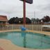 Best Budget Inn - Abilene outdoor pool with fenced deck and nearby parking lot