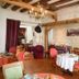 La Demeure Saint-Ours in Loches: cozy hotel dining room with chandeliers, exposed beams and set tables