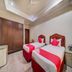 Hotel Ik London Residency Hyderabad twin room with two single beds and wardrobe
