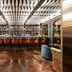 Seda Club Hotel in Granada bar lounge with mirrored ceiling, backlit shelves and velvet stools