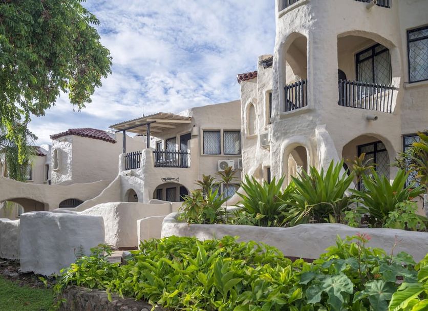 Caribbea Bay Resort in Kariba with landscaped gardens and arched balconies