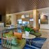 Fairfield by Marriott Inn & Suites Sandusky lobby with seating area, TV, and blue patterned rug