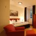 Klosterhotel Wöltingerode in Vienenburg guest room with bed, seating area, desk and large windows