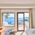 Gardenia Hotel in Kaş room with sea view, balcony door, sofa, and bed