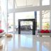 Cititel Hotel Dumai lobby in Dumai with white sofas, red cushions, and tall glass windows