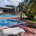 Hotel Seri Malaysia Kulim pool area with lounge chairs, palm trees, and a turquoise swimming pool in Kulim