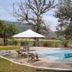 Hotel Villa Cantabria in Mascota with outdoor pool, lounge chairs and mountain views