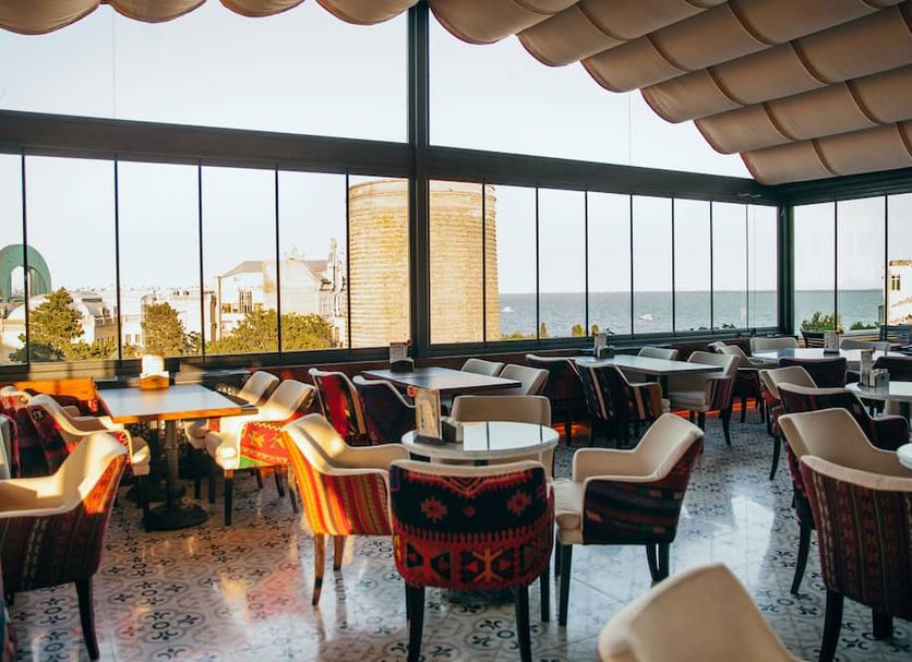 Sultan Inn Boutique Hotel Baku rooftop terrace dining area with sea views