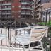Hotel Plaça in Sant Feliu de Guíxols balcony with two white chairs overlooking nearby buildings