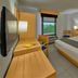City Express by Marriott Lazaro Cardenas guest room with bed, desk, and window view
