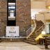 Lobby at Bristol International Guarulhos in Guarulhos with twin curved staircases and marble wall
