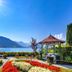 Grand Hotel Zell am See in Zell am See with lake and mountain views from a landscaped garden gazebo