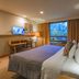 Hacienda Jurica by Brisas room in Santiago de Querétaro with king bed, desk, and large window view