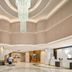 Kyriad Hotel Guangzhou Panyu Aoyuan Plaza lobby in Guangzhou with a grand chandelier and globe decor