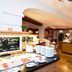 Karma Bavaria in Schliersee breakfast buffet with hot and cold dishes, wooden counters and dining area