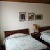 Hostal Bogotá Real in Bogotá guest room with two twin beds and bedside lamp