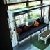 Chalay Monta Hua Hin lobby seating with hanging daybed and coffee table