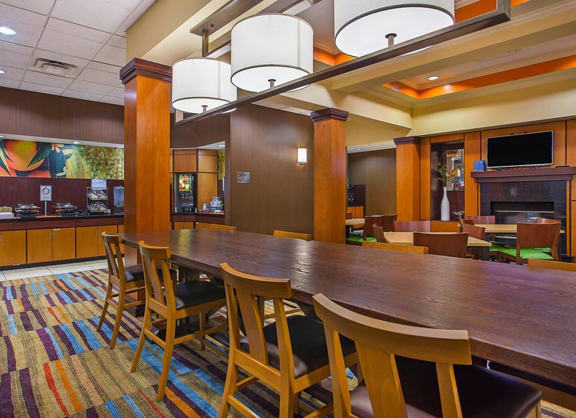 Fairfield Inn & Suites by Marriott Cookeville lobby with long communal table and colorful carpet
