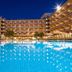 Gf Fañabe in Adeje with illuminated outdoor pool and multi-story hotel buildings at night