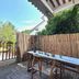 Tonight Inn Hangzhou balcony with table, chairs, bamboo fencing and leafy neighborhood views
