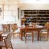 Hotel Rural Casa de Samaioes in Chaves dining room with wine display and wooden tables