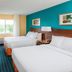 Fairfield Inn & Suites by Marriott South Bend Mishawaka room with two beds, desk and window in Mishawaka