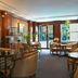 Meliá Paris Vendôme lounge with seating, wood paneling and glass doors in Paris