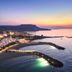 Knossos Beach Bungalows Suites Resort & Spa in Kokkini Hani with beachfront bungalows and sea view at sunset