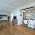 Una Hotels Le Terrazze Treviso Hotel & Residence living area with sofa and kitchen, Villorba